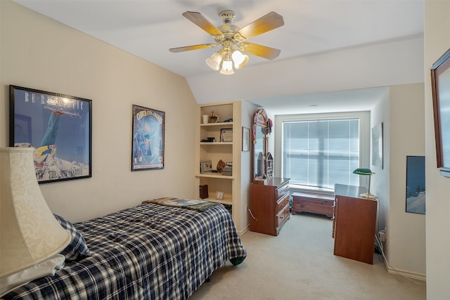 carpeted bedroom with vaulted ceiling and ceiling fan