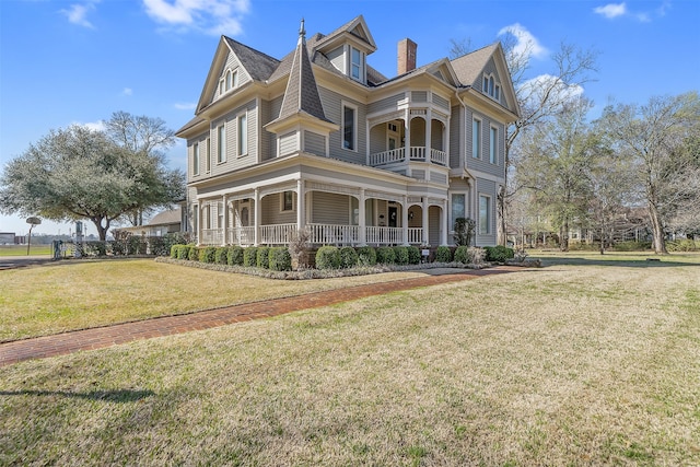 victorian home featuring a front yard and a porch