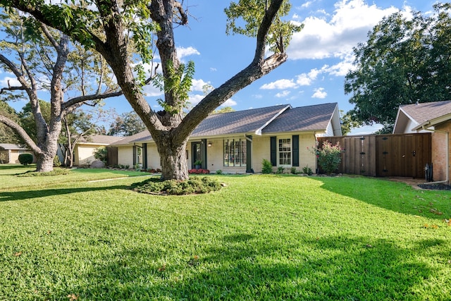 ranch-style house with a front yard