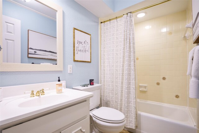 full bathroom featuring shower / tub combo with curtain, vanity, and toilet