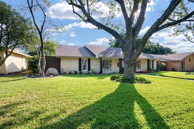 ranch-style house with a front yard