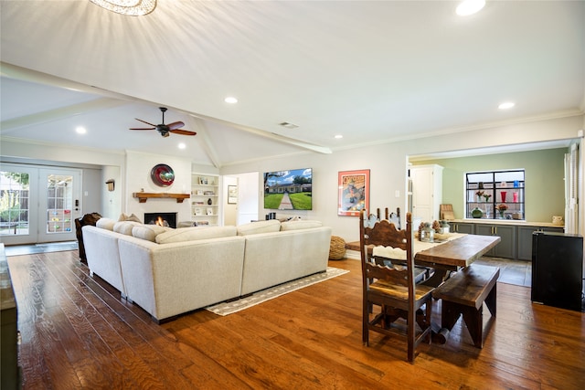 living room featuring ornamental molding, dark hardwood / wood-style flooring, ceiling fan, and lofted ceiling