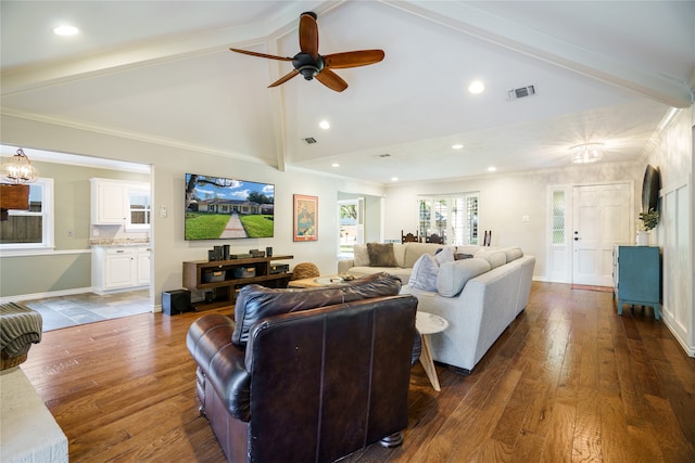 living room featuring ornamental molding, ceiling fan with notable chandelier, dark wood-type flooring, high vaulted ceiling, and beamed ceiling