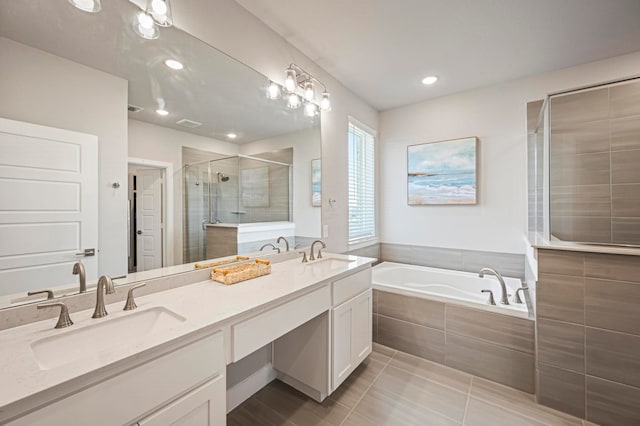 bathroom featuring tile patterned flooring, vanity, and independent shower and bath