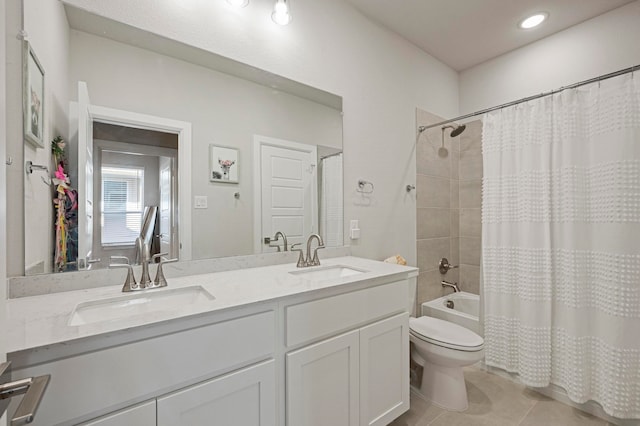 full bathroom featuring tile patterned flooring, vanity, shower / bath combination with curtain, and toilet