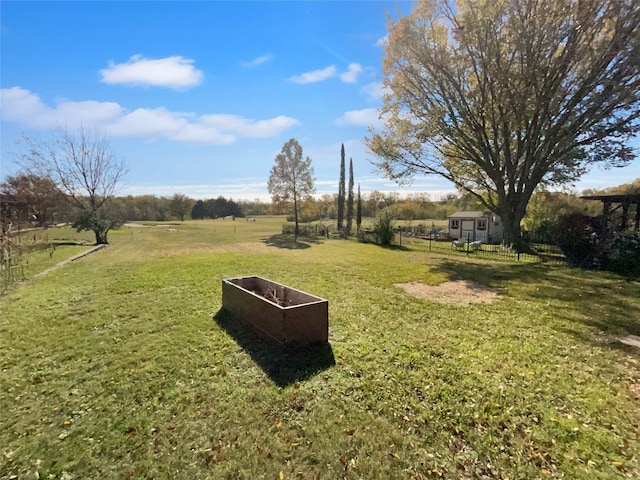 view of yard with a rural view