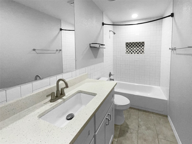 full bathroom with tile patterned flooring, vanity, toilet, and tiled shower / bath