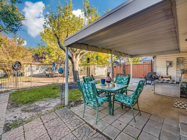 view of patio featuring outdoor dining area and a fenced backyard