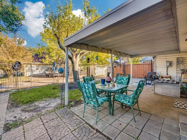 view of patio featuring fence private yard and outdoor dining space