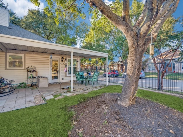 view of yard with a patio and fence