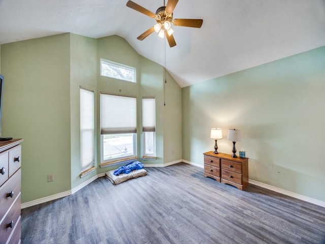 interior space featuring ceiling fan, wood finished floors, and baseboards