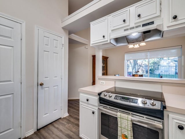 kitchen featuring light countertops, stainless steel electric range, white cabinets, and under cabinet range hood