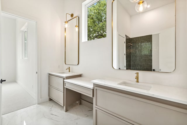 bathroom with a shower and vanity