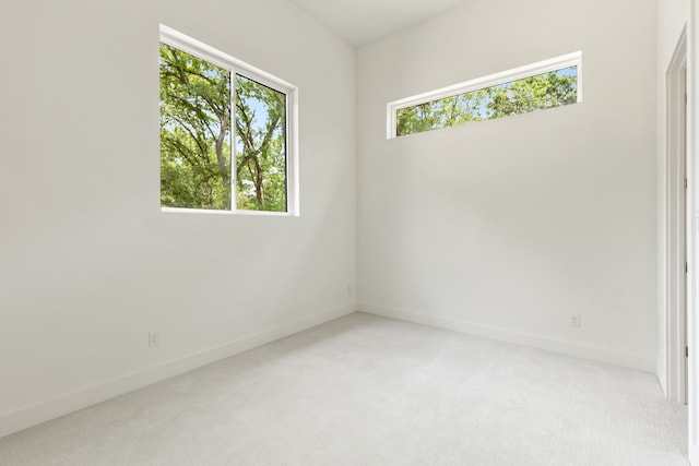 empty room featuring light colored carpet