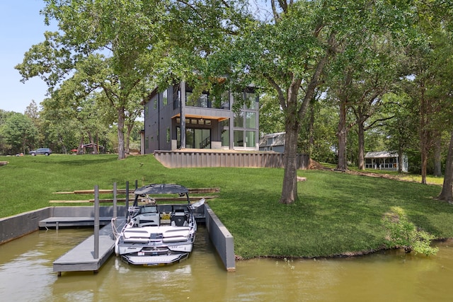 dock area featuring a yard and a water view