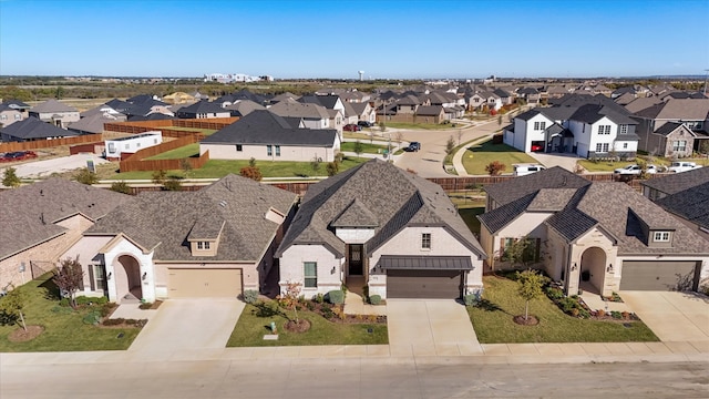 birds eye view of property with a residential view