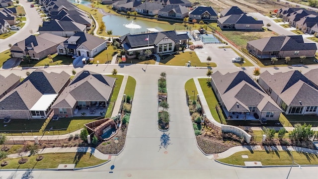 bird's eye view with a water view and a residential view