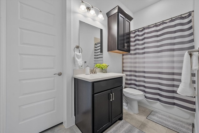 bathroom featuring toilet, tile patterned floors, and vanity