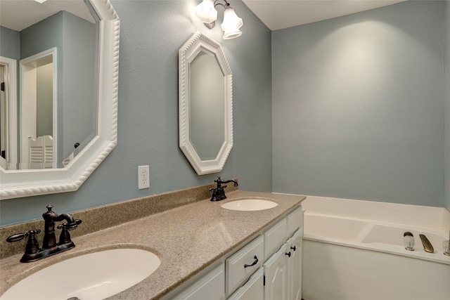 bathroom with vanity and a bathing tub