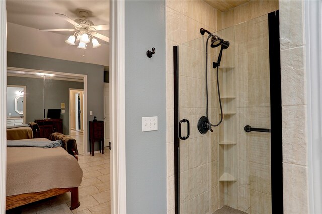 bathroom featuring tile patterned floors, ceiling fan, and a shower with shower door