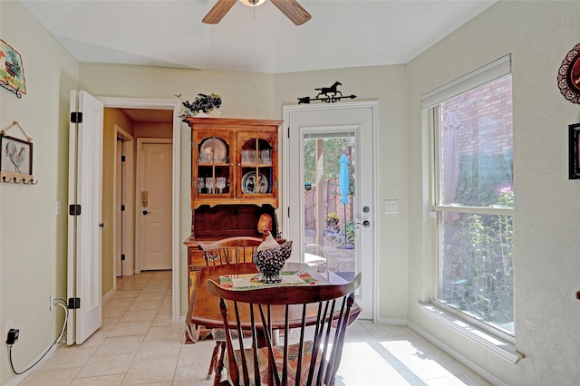 dining room with plenty of natural light, ceiling fan, and light tile patterned flooring