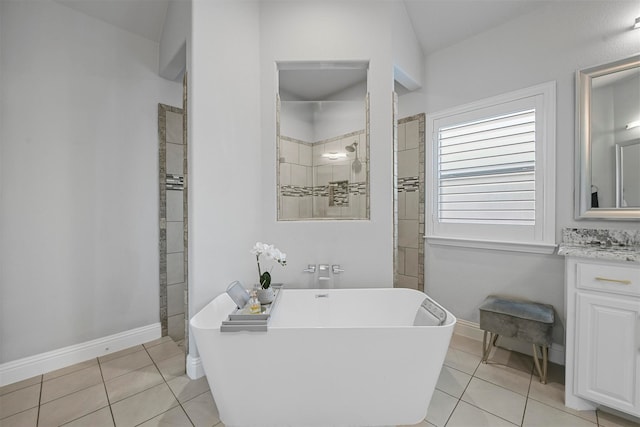 bathroom featuring tile patterned floors, shower with separate bathtub, and vanity