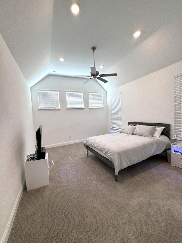 carpeted bedroom with ceiling fan and lofted ceiling