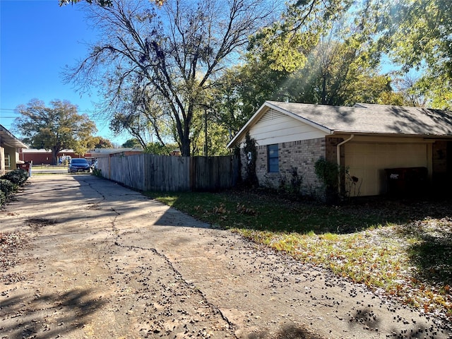 view of property exterior featuring a garage