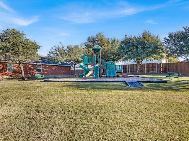 view of playground with a lawn