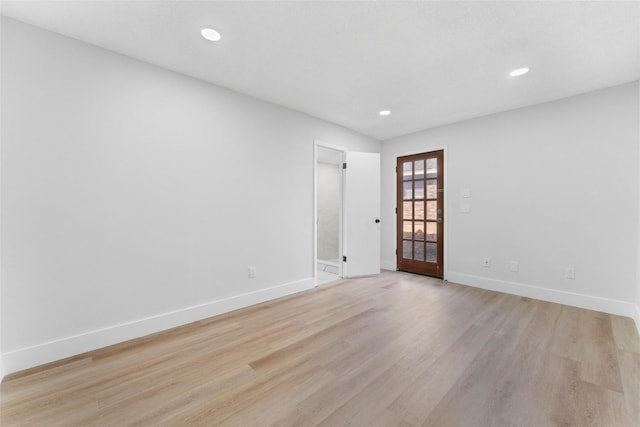 unfurnished room featuring light hardwood / wood-style floors