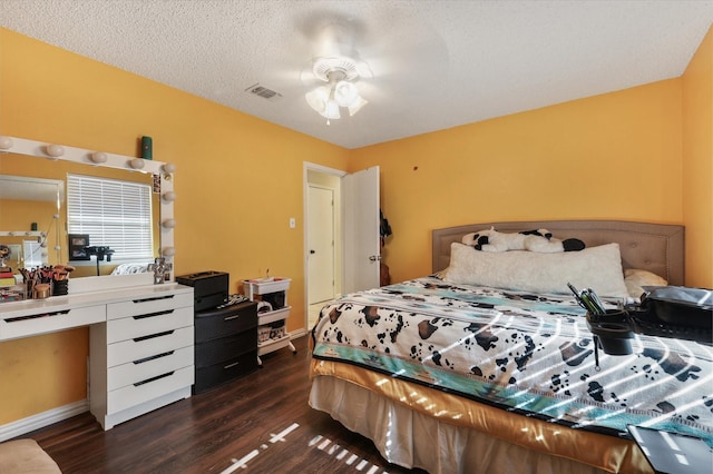 bedroom featuring dark wood-type flooring and baseboards