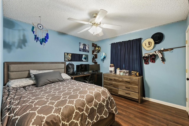 bedroom with wood finished floors, baseboards, a textured ceiling, and a ceiling fan