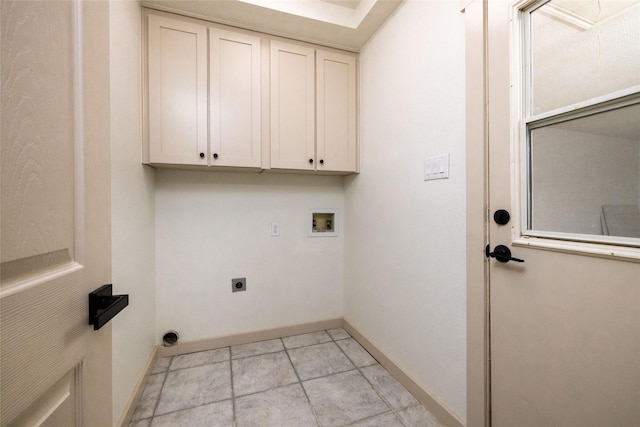 laundry area with hookup for an electric dryer, cabinets, and washer hookup