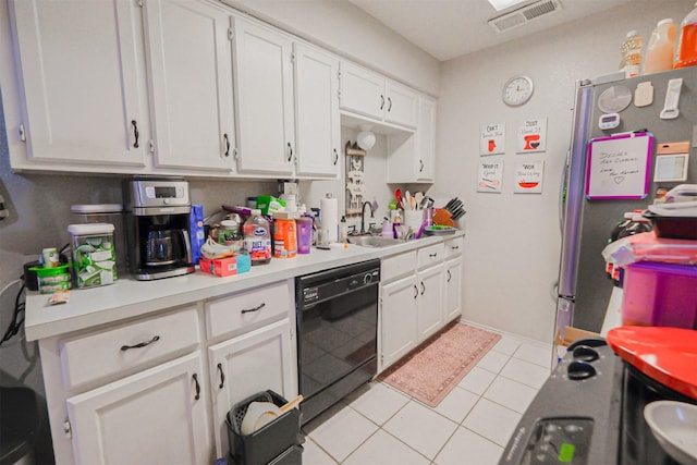 kitchen with white cabinets, stainless steel fridge, black dishwasher, and sink