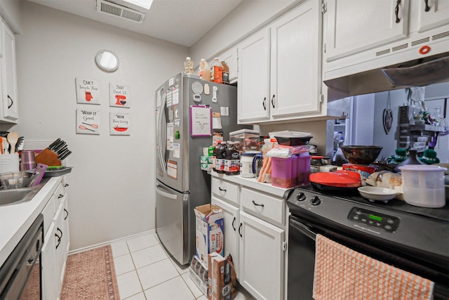 kitchen with light tile patterned flooring, white cabinetry, and black appliances