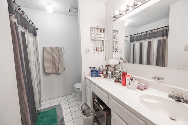 bathroom featuring tile patterned floors, a textured ceiling, toilet, vanity, and a shower with shower curtain