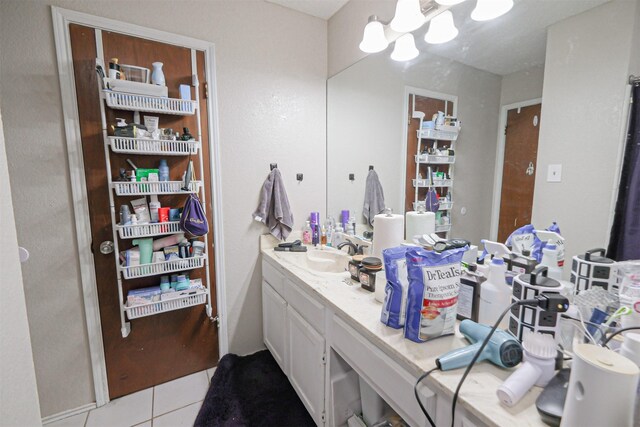 bathroom with tile patterned floors and vanity