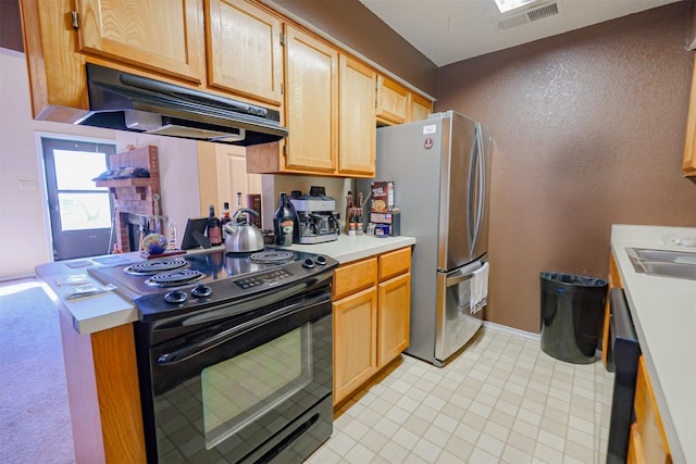 kitchen featuring stainless steel fridge, black range with electric cooktop, light brown cabinetry, and sink