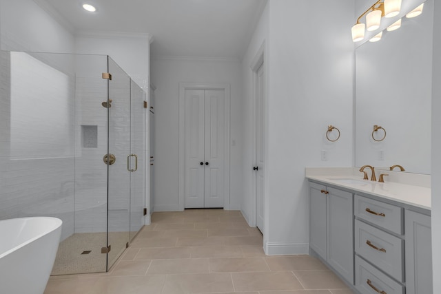 bathroom with tile patterned floors, crown molding, vanity, and independent shower and bath