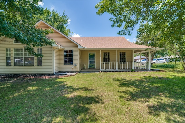 view of front facade with a porch and a front lawn