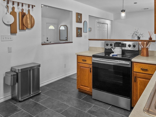 kitchen with hanging light fixtures and electric stove