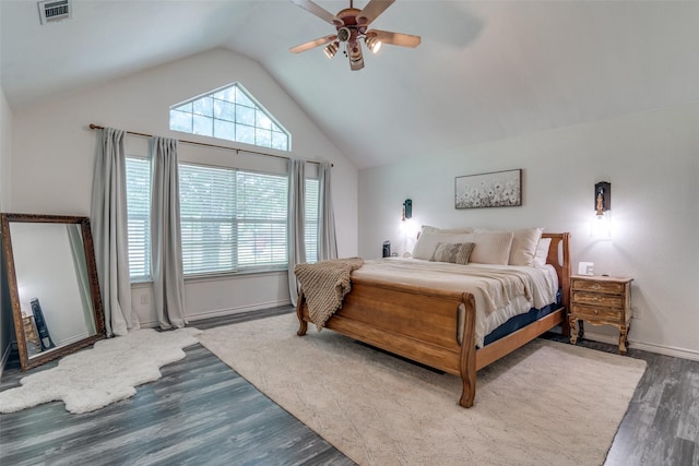 bedroom with hardwood / wood-style flooring, ceiling fan, and vaulted ceiling