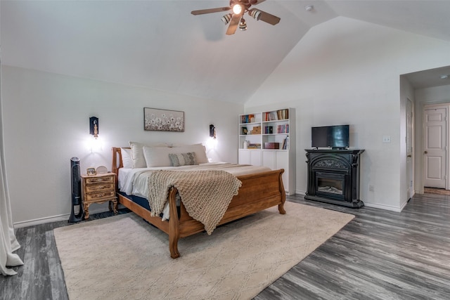 bedroom featuring wood-type flooring, high vaulted ceiling, and ceiling fan