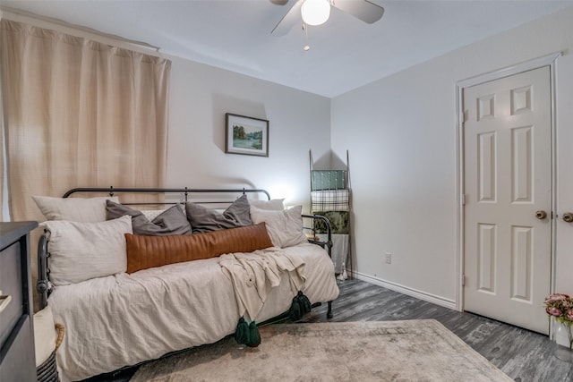 bedroom featuring dark wood-type flooring and ceiling fan