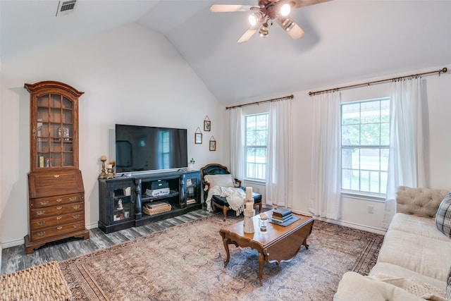 living room with lofted ceiling, hardwood / wood-style floors, a wealth of natural light, and ceiling fan