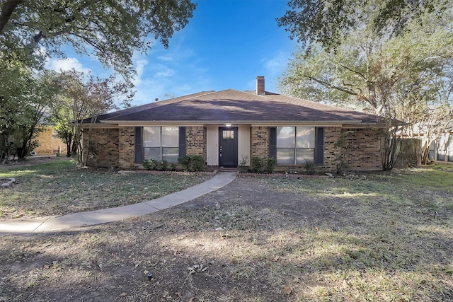 ranch-style home with a front lawn