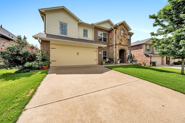 view of front of home with a front lawn and a garage