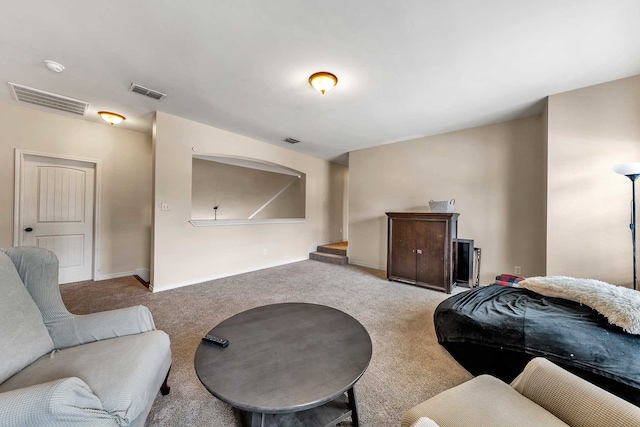 living room featuring light carpet