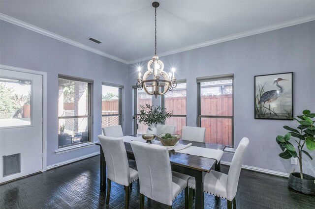 dining area with ornamental molding, dark parquet floors, and a notable chandelier