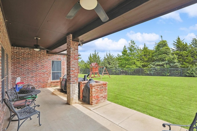 view of patio / terrace featuring a playground and ceiling fan